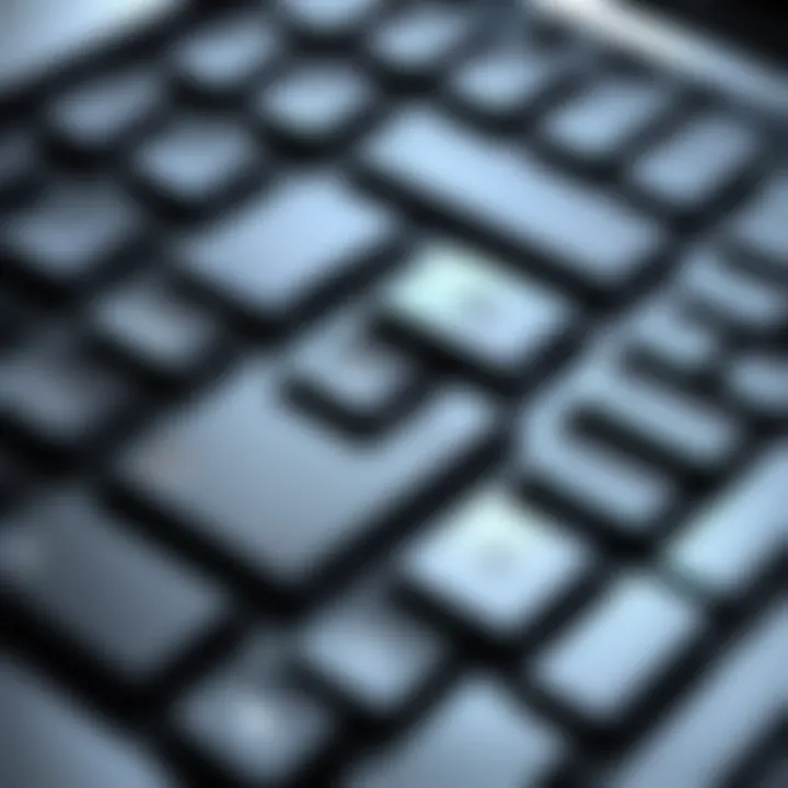 Close-up of laptop keyboard with recording button highlighted