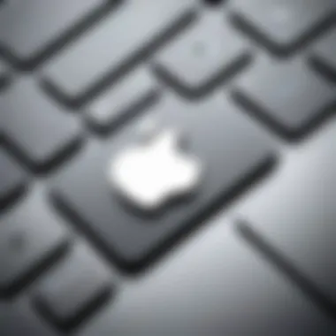 Close-up of Apple logo on MacBook keyboard